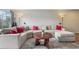 Comfortable living room featuring a large sectional sofa, patterned rug, and decorative lighting at 1818 S Quebec Way # 11-3, Denver, CO 80231