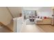 Bright living room with comfortable seating, fireplace, and view of the staircase at 1818 S Quebec Way # 11-3, Denver, CO 80231
