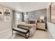 Comfortable bedroom with a well-decorated bed, stylish decor, and a view from the window at 13333 Blue Amber Ct, Parker, CO 80134