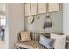 Charming entryway with a bench, decorative wall art, and views to the dining area at 13333 Blue Amber Ct, Parker, CO 80134