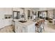 Modern kitchen featuring a large island with bar seating, stainless steel appliances, and ample cabinet space at 13333 Blue Amber Ct, Parker, CO 80134