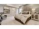 Relaxing main bedroom with a decorative headboard, a comfortable bed, and a sitting area with a chair at 13333 Blue Amber Ct, Parker, CO 80134