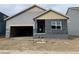 Charming single-Gathering home featuring a two-car garage, a covered porch and horizontal siding at 15275 Milwaukee St, Thornton, CO 80602