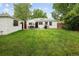 Well-manicured backyard with patio and detached shed at 1852 S Elm St, Denver, CO 80222