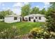 Landscaped backyard with patio, shed, and flower garden at 1852 S Elm St, Denver, CO 80222
