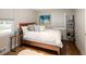 Cozy bedroom with hardwood floors, a plush rug, and bright natural light at 1852 S Elm St, Denver, CO 80222