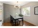 Stylish dining room with hardwood floors, decorative wallpaper and modern light fixture at 1852 S Elm St, Denver, CO 80222