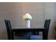 Dining room table with white flowers as a centerpiece at 1852 S Elm St, Denver, CO 80222