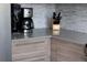 Close-up of a kitchen featuring modern countertops, stainless steel appliances, and sleek cabinetry at 1852 S Elm St, Denver, CO 80222