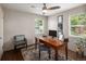 Well-lit home office with wood desk, a cozy rug and natural light at 1852 S Elm St, Denver, CO 80222