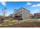 Spacious backyard with deck, patio, landscaped areas, and a play area at 1114 Basalt Ridge Loop, Castle Rock, CO 80108