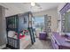 Fun ' bedroom with custom bunk bed, bright decor, and natural light from the window at 1114 Basalt Ridge Loop, Castle Rock, CO 80108