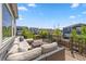 Spacious outdoor deck furnished with comfortable seating, perfect for relaxation and enjoying the neighborhood view at 1114 Basalt Ridge Loop, Castle Rock, CO 80108