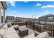Outdoor deck with comfortable seating, offering a neighborhood view on a sunny day at 1114 Basalt Ridge Loop, Castle Rock, CO 80108