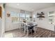 Sunlit dining room with modern table, ample windows, and stylish decor that create a comfortable atmosphere at 1114 Basalt Ridge Loop, Castle Rock, CO 80108