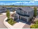 Beautiful two-story home with a manicured lawn, attached two-car garage, and inviting front porch at 1114 Basalt Ridge Loop, Castle Rock, CO 80108