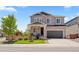 Charming two-story home with a well-maintained lawn, inviting front porch, and attached two-car garage at 1114 Basalt Ridge Loop, Castle Rock, CO 80108