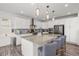 Modern kitchen with granite countertops, stainless steel appliances, a large center island, and ample cabinet space at 1114 Basalt Ridge Loop, Castle Rock, CO 80108