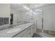 Modern main bathroom with double vanity, granite countertops, and frameless glass shower creating a luxurious experience at 1114 Basalt Ridge Loop, Castle Rock, CO 80108