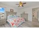Bright main bedroom with large windows, stylish bedding, and modern furnishings providing a comfortable retreat at 1114 Basalt Ridge Loop, Castle Rock, CO 80108
