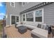 Outdoor patio with modern gray sofa set and awning, perfect for entertaining at 1114 Basalt Ridge Loop, Castle Rock, CO 80108