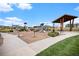Community playground with slides and shaded seating areas, perfect for Gathering fun and outdoor activities at 1114 Basalt Ridge Loop, Castle Rock, CO 80108