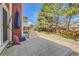 A large backyard featuring a patio, mature trees, and wood fence is great for outdoor living and privacy at 17509 E Kenyon Dr, Aurora, CO 80013