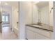 Modern bathroom with granite countertops, tiled floors, bath tub with shower, and neutral paint at 7440 S Yank Ct, Littleton, CO 80127