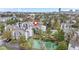 Aerial view highlighting the complex's tennis court, pool, and surrounding green spaces at 9837 E Peakview Ave # D05, Englewood, CO 80111