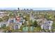 Aerial view showcasing the condo community, surrounding greenery, and a convenient tennis court at 9837 E Peakview Ave # D05, Englewood, CO 80111