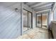 Balcony view featuring wood floor, siding, and access to additional rooms at 9837 E Peakview Ave # D05, Englewood, CO 80111