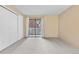 This spacious bedroom is carpeted and features a sliding glass door at 9837 E Peakview Ave # D05, Englewood, CO 80111