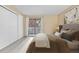 This bedroom features a sliding glass door that offers ample natural light at 9837 E Peakview Ave # D05, Englewood, CO 80111