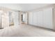 Neutral bedroom features plush carpet, ample closet space, and ensuite bath access at 9837 E Peakview Ave # D05, Englewood, CO 80111