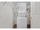 This laundry room features a stacked washer and dryer at 9837 E Peakview Ave # D05, Englewood, CO 80111