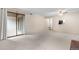 Clean and spacious living room with neutral carpet and large sliding doors at 9837 E Peakview Ave # D05, Englewood, CO 80111