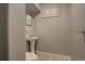 Cozy half bathroom featuring a pedestal sink, toilet, and mirror at 11241 Ogden Dr, Northglenn, CO 80233