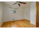 This cozy bedroom featuring hardwood floors and a window provides a comfortable living space at 11241 Ogden Dr, Northglenn, CO 80233