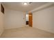 Bedroom with neutral carpet, overhead lighting, and open doorway at 11241 Ogden Dr, Northglenn, CO 80233