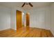 Bright bedroom featuring hardwood floors and closet offers a serene and organized space at 11241 Ogden Dr, Northglenn, CO 80233