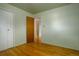 Airy bedroom with hardwood floors and trim offers closet space at 11241 Ogden Dr, Northglenn, CO 80233