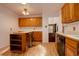 Traditional kitchen with wood cabinets, breakfast bar seating, and modern appliances for a functional and inviting space at 11241 Ogden Dr, Northglenn, CO 80233