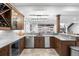 Open bar area with extensive cabinetry, wine storage, and modern lighting at 2821 E Cedar Ave # 2, Denver, CO 80209