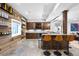 Well-equipped bar featuring wood accents, seating, and a beverage cooler at 2821 E Cedar Ave # 2, Denver, CO 80209