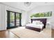 Bright primary bedroom with high ceilings, natural light, and access to outdoor pool at 2821 E Cedar Ave # 2, Denver, CO 80209