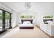Bright primary bedroom with vaulted ceilings, natural light, and a luxurious rug at 2821 E Cedar Ave # 2, Denver, CO 80209