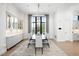 Bright dining room featuring modern built-ins, large windows, and sleek table setting at 2821 E Cedar Ave # 2, Denver, CO 80209