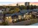 Beautiful home featuring stone and gray siding, a three-car garage, and meticulous landscaping at 2821 E Cedar Ave # 2, Denver, CO 80209