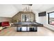 Luxurious game room with a stylish pool table, modern lighting, and comfortable seating at 2821 E Cedar Ave # 2, Denver, CO 80209