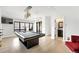 Spacious game room featuring a pool table, custom lighting, and a comfortable seating area at 2821 E Cedar Ave # 2, Denver, CO 80209